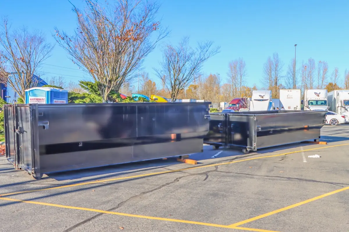 Professional dumpster rental service with roll-off container on residential driveway in Largo